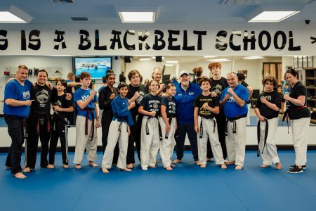 Grandmaster Del Castillo in a group photo with blackbelt students.